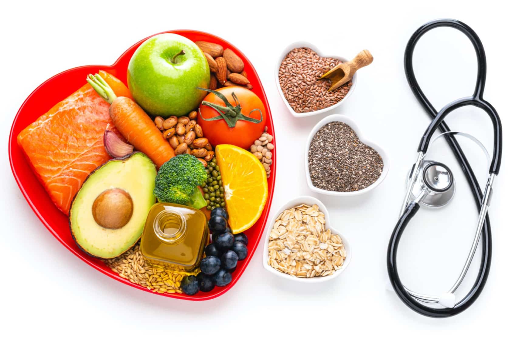 Healthy food in heart shaped bowl with stethoscope